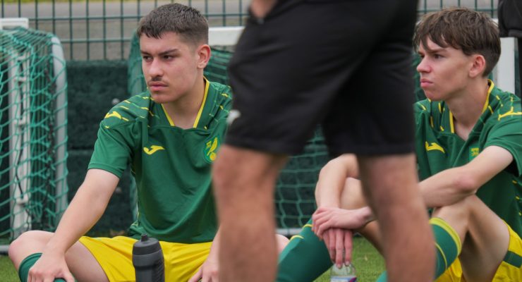 Boys sitting on pitch