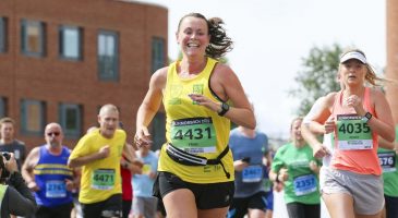 women running in yellow top