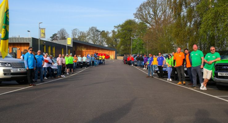 Cars and their drivers outside The Nest