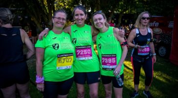 3 women in green tshirts