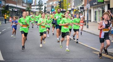 junior runners in green tshirts 