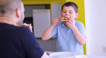 young boy eating