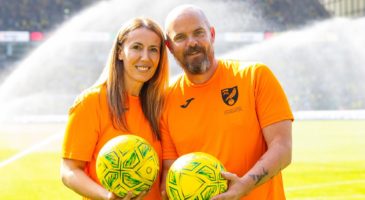 Two volunteers on pitch