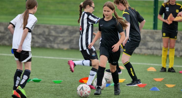 Girls playing football