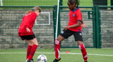 Girls playing football