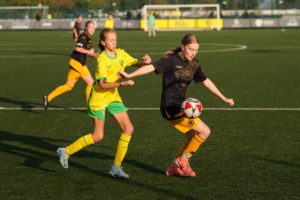 Girls playing football