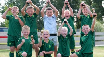 Children lifting trophy