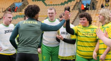 Man high fiving participants