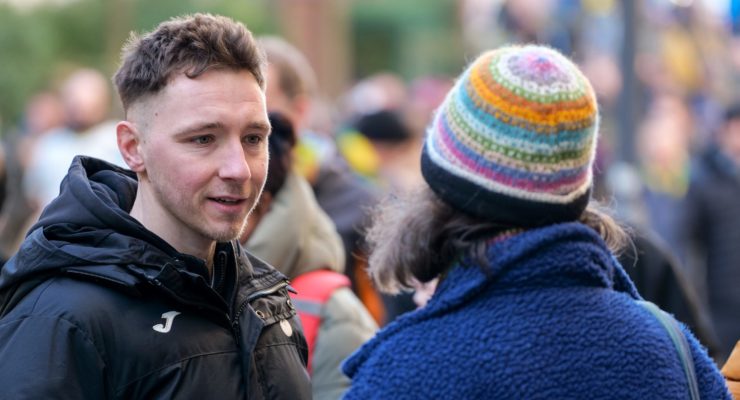 Man speaking to woman