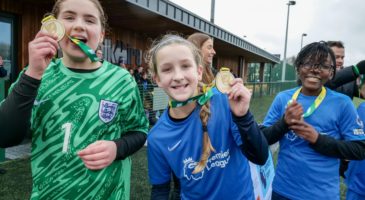 Girls with medals celebrating